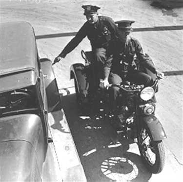 Traffic Police on motorcycle (c. 1934).
