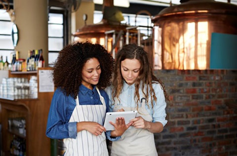 Two working women in aprons