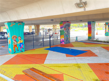 Dolorosa columns at The Pass basketball court by artists Eva Marengo Sanchez and Mike Arguello.