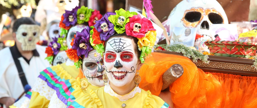 A woman in skeleton makeup in market square