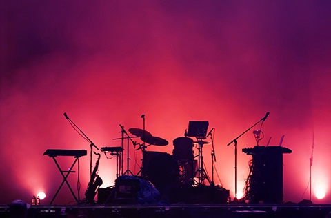 Silhouette of a stage with band equipment.