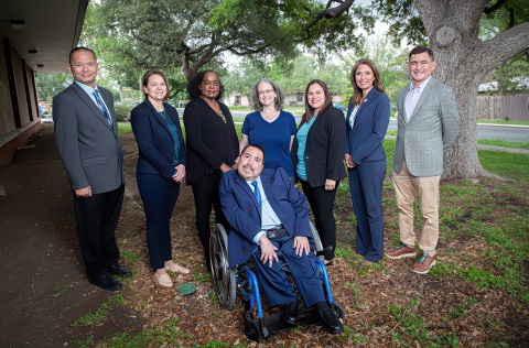 The 2023 Disability Access Advisory Committee, including eight members posing outdoors, one member in a wheelchair.