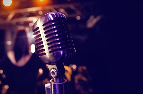 Close up of a retro silver microphone.