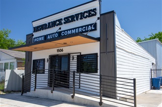 Exterior of a building featuring the business name on the front, showcasing its business identity.
