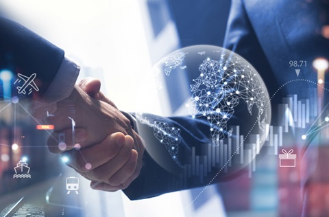 Two businessmen shake hands on a deal, set against a digital graphic backdrop.