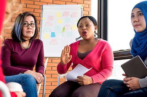 Group of diverse women discussing during a meeting