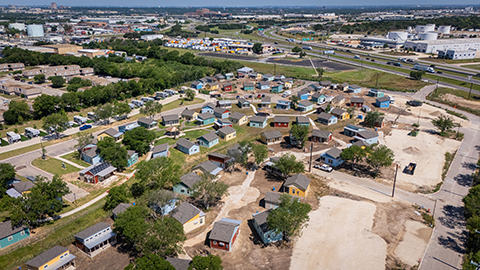 Towne Twin Village community shows an ariel view of the multi-colored, single-family tiny homes.