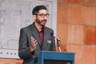 City of San Antonio Archivist standing at a podium, speaking during the Grand Opening ceremony of the Municipal Archives Museum.