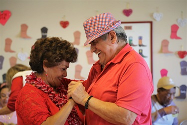 Two seniors dancing