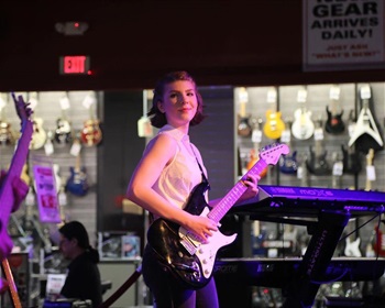 Woman playing guitar. 