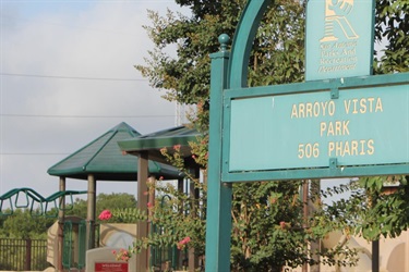 A view of the park and the entrance sign.