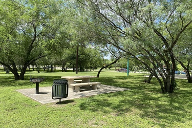 Joan Price Park bench, grill and garbage pail