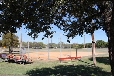 Kenwood Park bleachers, bench and baseball field