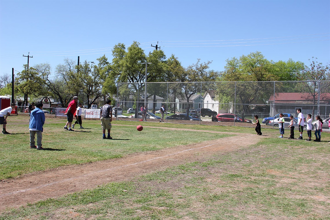 Labor Street Park people playing kickball