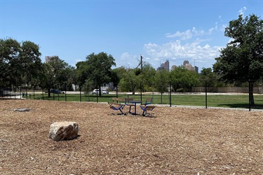 Bench with part of the San Antonio skyline in the background