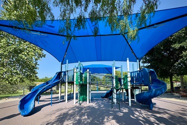 Playground with blue awning.