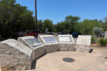 Trail map and information displayed on raised stones.