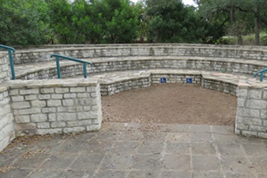 Outdoor seating on circular stone bench