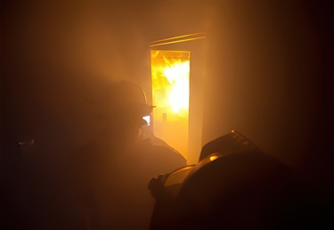 SAFD firefighter candidates fight a building training fire.