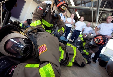 SAFD firefighter candidates train in responding to incidents involving downed firefighter.