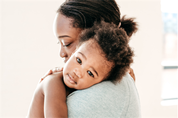 Mother holding a baby.