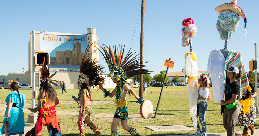 A procession at the dia de los muertos celebration at mission marquee