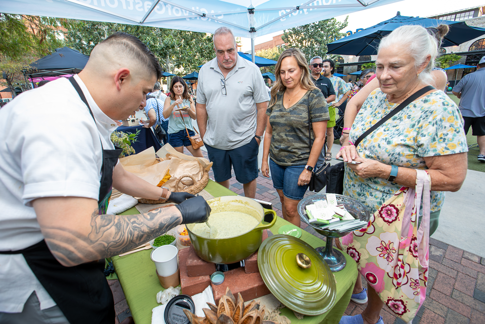 A man making food for residents