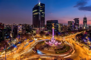Night view of high-speed timelapse movement around Angel of Independence roundabout in Mexico City, Mexico.