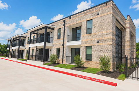 Memorial Apartments rendering shows the complex will be beige and charcoal, dual-level and will include a colorful mural on one of the entrances.