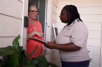 Health Worker talking to a Home Owner