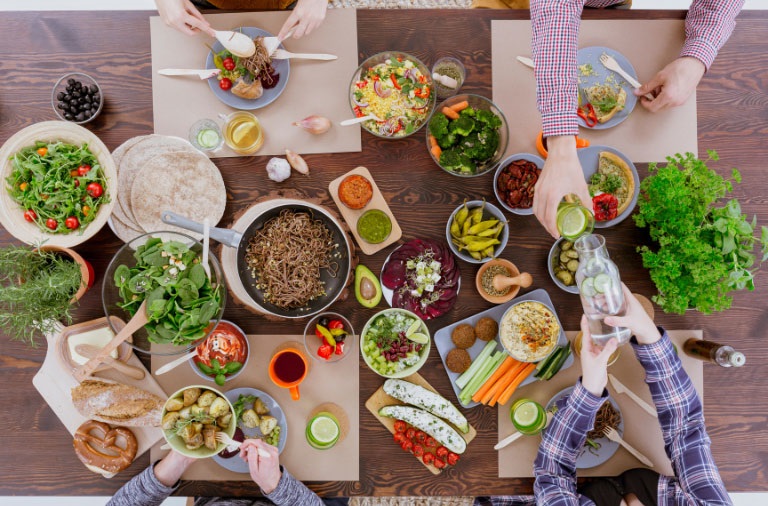A group of people enjoying a meal together at a table.