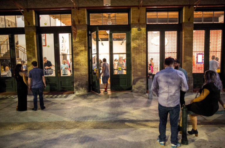  Visitors viewing artwork in a gallery.