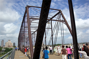 Pedestrians crossing the Hays Street Bridge.